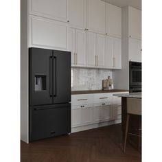 a black refrigerator freezer sitting inside of a kitchen next to white cabinets and counter tops