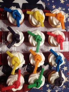 cupcakes with colorful icing are arranged in an american flag pattern on top of each other