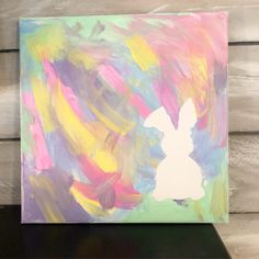 an abstract painting with white rabbit on it