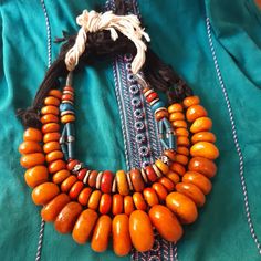 Three old Berber Necklace stone & Bead resin amber color, Ethnic Jewelry Morocco | eBay Artisan Necklace With Large Beads For Rituals, Bohemian Orange Beads For Jewelry Making, Vintage Amber Necklaces For Festivals, Bohemian Jewelry With Large Beads For Rituals, Amulet Necklaces With Large Beads For Rituals, Vintage Amber Jewelry With Large Beads, Orange Wooden Beads Jewelry For Festival, Bohemian Carnelian Jewelry In Orange, Bohemian Carnelian Orange Jewelry