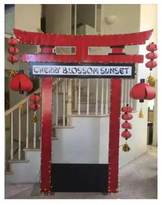 a sign that says cherry blossom street in front of some red lanterns and decorations on the stairs