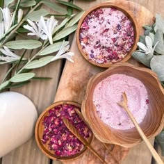 three wooden bowls filled with different types of body scrubs