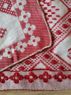 some red and white cloths on a wooden table