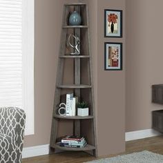 a corner shelf with books on it in a living room