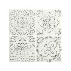 four black and white tile designs on a white background, each with an intricate design