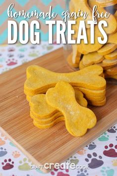 homemade grain free dog treats on a wooden cutting board with paw prints in the background