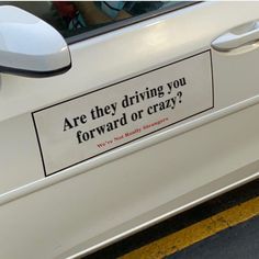 a car with a sticker on the door saying are they driving you forward or crazy?