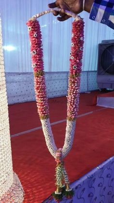 a person is placing flowers on the side of a table