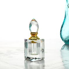 PRICES MAY VARY. Specification: This empty bottle is made of high quality K9 Crystal, the clear color makes the bottle more textured.Size: 1.5*3.3in; Capacity: 3ml; Net Weight: 132g/pcs. Unique Design: This beautiful clear crystal empty perfume bottle make putting on your favorite fragrance a luxurious experience and add a glamorous touch to decor. Handmade Crystal Bottle: Each handcrafted faceted crystal bottle is embellished with different crystal shaped stoppers that add a pop of amazing colo Egyptian Perfume Bottles, Crystal Bottle, Empty Perfume Bottles, Pretty Perfume, Decorative Bottles, Travel Perfume, Crystal Perfume Bottles, Crystal Ornament, Crystal Shapes