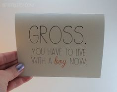 a hand holding a card that says gross you have to live with a boy now