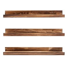 three wooden shelves are shown against a white background