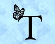 the letter t with a butterfly on it's back is shown in black against a blue marble background