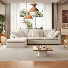 a living room with a large white sectional couch