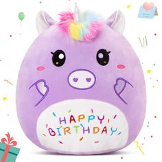 a purple stuffed animal with a unicorn horn on it's head and the words happy birthday