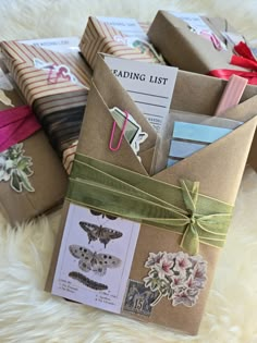 several envelopes are wrapped in brown paper and tied with ribbons, some have butterflies on them