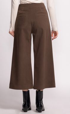 Introducing the Nadia Pants: a chic cropped wide-leg silhouette that pairs effortlessly with anything in your wardrobe. These versatile pants are perfect for casual or elevated looks. Material: 70% Polyester, 20% Polyamide, 10% Cotton Side zip opening Model is wearing XS Versatile Pants, Cute Boots, Dress Gift, Sweater Sale, Blazer Dress, Outerwear Coats, Denim Pant, Cinched Waist, Bottoms Pants