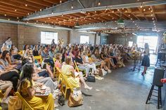 a large group of people sitting in chairs