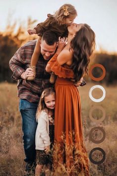 an adult and two children are posing for a photo in a field with their parents