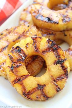 grilled pineapple rings on a white plate