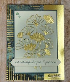 a card with gold foil flowers on it