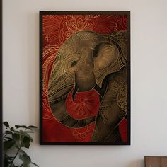 an elephant painting hanging on the wall next to a potted plant