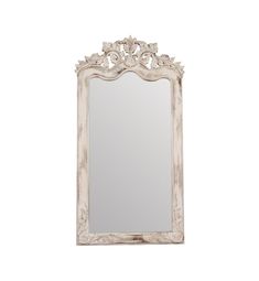 an ornate white mirror on a white wall