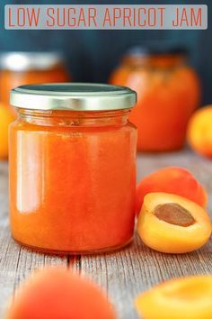 apricot jam in a glass jar with sliced apricots on the side