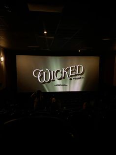 a movie screen with the words'quicked'projected on it