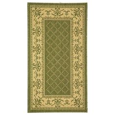 a green and beige rug with an ornate design on the bottom, in front of a white background