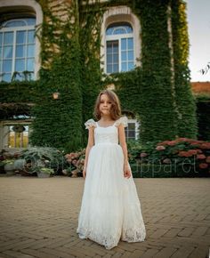 This gorgeous dress features a very elegant, yet simple, style!  The dress is completely lined and adorned with lace. Back elastic and bow for ease and comfort!  A full tulle skirt with gown length. The ivory color adds a bit of vintage charm. This gown is fully lined in 100% cotton for a comfortable feel. We know that tulle can be scratchy, and kids don't like scratchy dresses! We're here to provide you with the perfect combination of elegance and comfort for your next formal occasion. This gow Princess Dress With Lace Bodice For First Communion, Princess Style Lace Dress For First Communion, Elegant Lace Princess Dress For First Communion, White Lace Trim Princess Dress For Confirmation, Lace Tulle Gown For First Communion, Elegant Lace Bodice Dress For Confirmation, White Tulle Lace Dress For Bridesmaid, Elegant Lace Dress With Lace Bodice For Confirmation, Fitted First Communion Dress With Lace Sleeves