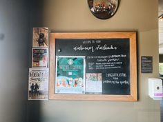 a blackboard with information on it in front of a mirror