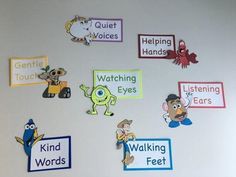 a bulletin board with different types of words on it and pictures attached to the wall