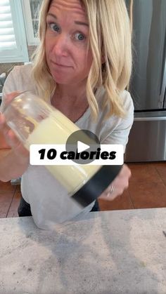 a woman is pouring some milk into a blender with the words 10 calories on it