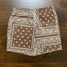 Mens Brown Bandana Paisley Shorts Size Large Brand New Short Fitting Measurements- Inseam 6 Inches 2 Front Pockets 1 Back Pocket 100% Polyester Message For Questions Casual Paisley Print Bottoms For Vacation, White Casual Bottoms With Paisley Print, Casual White Bottoms With Paisley Print, Casual Brown Printed Bottoms, Summer White Bottoms With Paisley Print, Summer Cotton Bottoms With Paisley Print, Summer Patterned Bottoms With Paisley Print, Summer Cotton Bottoms With Bandana Print, Brown Pocketed Shorts For Streetwear