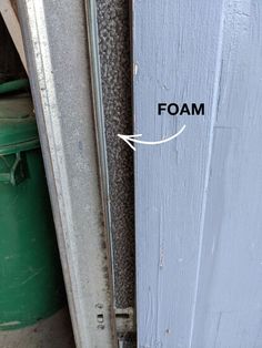 the bottom half of a door with foam on it and an arrow pointing up at the bottom