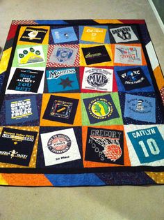 there is a quilt with many different patches on it