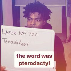 a man holding up a sign that says the word was pterodactly