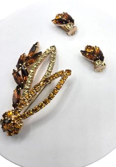 Gorgeous Floral leaf brooch and matching earrings. Vintage from 1940s Golden citron Carmel shades. all stones intact. Gorgeous glittering vintage jewelry stunner. Brooch is 2.5" clip on earrings are .75" climbers. Unsigned as all D & E Juliana. Please see my other listings for many amazing unique and vintage pieces.  Thank you for looking and have a happy day! Have A Happy Day, Leaf Brooch, Vintage Brooch, Earrings Vintage, Clip Earrings, Vintage Pieces, Vintage Brooches, Matching Earrings, Festival Season