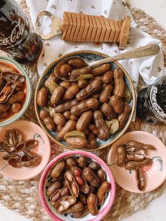 there are many nuts in bowls on the table