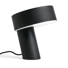 a black lamp with a white light on it