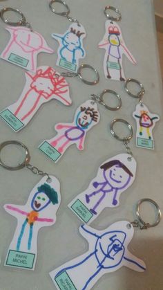 several different key chains with pictures of people on them