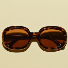 "Stay stylish and protected with these retro 60s-inspired sunglasses. The oversized lenses are polarized and the frame is made with acetate and TR90 for superior strength and comfort. The UV400 protective lenses are safe and durable, and the vintage style design will have you looking timeless. Approximate measurements:  5.78 inches x 2 inches  Lens height: 1.6\"	in stock	25.90 USD	"	4.00 USD	Accessories > Sunglasses & Eyewear > Sunglasses
https://i.etsystatic.com/5795811/r/il/87bbff/5066527921/i Retro Sunglasses With Tinted Lenses For Vacation, Retro Shield Sunglasses With Uva Protection For Vacation, Retro Shield Sunglasses With Uv Protection For Vacation, Retro Shield Sunglasses With Polarized Lenses, Retro Polarized Shield Sunglasses For Beach, Vintage Polarized Sunglasses For Vacation, Retro Polarized Sunglasses For Vacation, Retro Sunglasses With Uva Protection For Vacation, Big Sunglasses