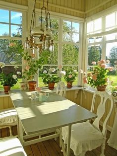 the sun shines through the windows into a dining room with white chairs and tables