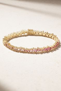 Suzanne Kalan's signature scattered setting is inspired by fireworks - this tennis bracelet captures the effect so beautifully with tonal-pink sapphires that fade to diamonds. It's handcrafted from 18-karat gold and looks especially chic with the coordinating necklace from the same collection. Gold Pink Earrings, Luxury Pink Sapphire Bracelets, Luxury Pink Gemstone Tennis Bracelet, Elegant Pink Sapphire Baguette-cut Jewelry, Elegant Pink Sapphire Jewelry Baguette Cut, Yellow Gold Tennis Bracelet With Gemstones, Luxury Pink Diamond Jubilee Bracelet, Luxury Pink Tennis Bracelet, Luxury Yellow Gold Tennis Bracelet With Sparkling Stones