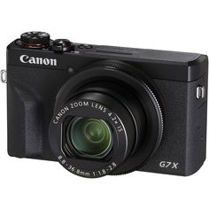 the canon g7x digital camera is shown with its lens pointed at the viewer