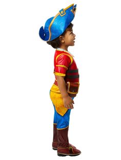 a young boy wearing a blue and yellow costume with a hat on top of his head