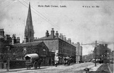 an old black and white photo of people on the street