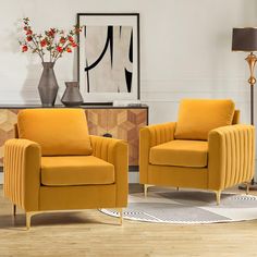 two yellow chairs sitting next to each other in a living room