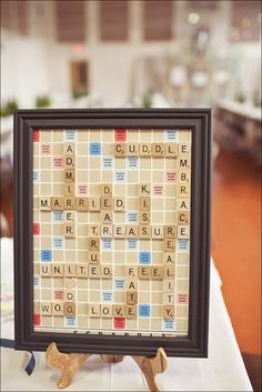 a scrabble board with words on it and a dog figurine next to it