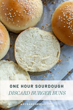 three hamburger buns with sesame seeds on top and the words, one hour sourdough disard burger buns